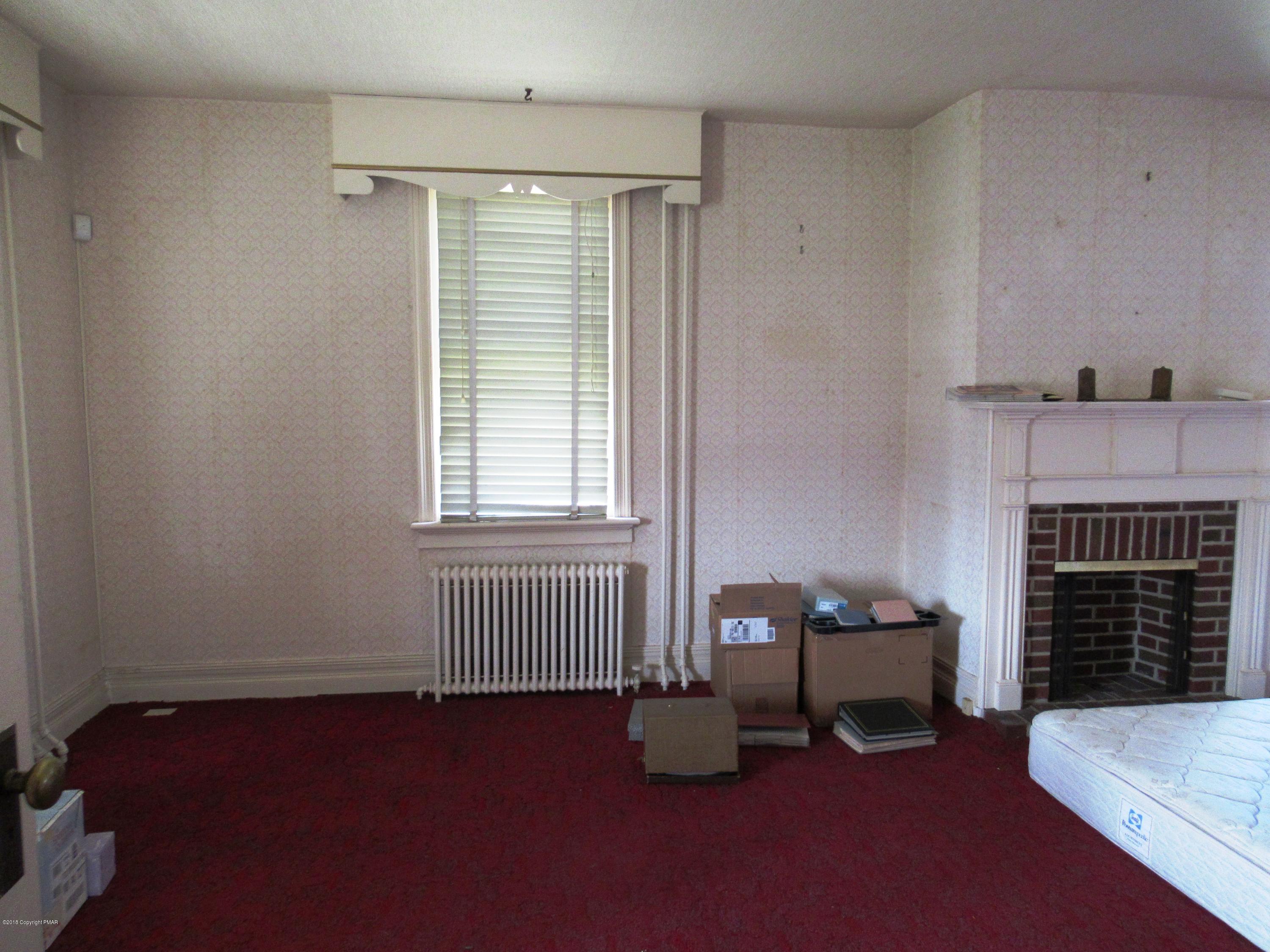 443 Bossardsville Road Stroudsburg, PA 18360 - Photo 6 of 43 a living room with furniture and a fireplace
