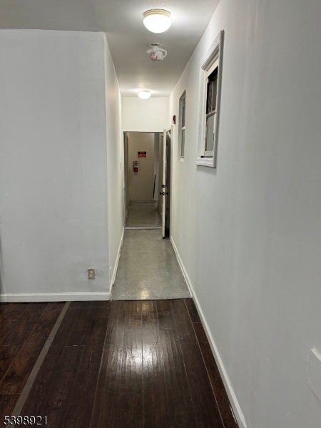 3 South Olden Avenue, Unit 10 Trenton, NJ 08609 - Photo 3 of 12 an entryway in a hall with wooden floor and a sink