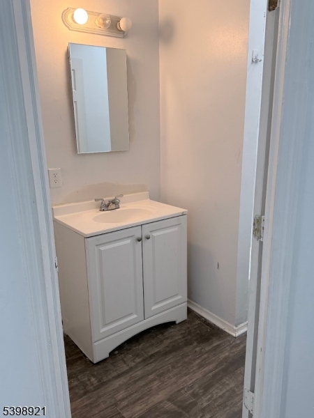 3 South Olden Avenue, Unit 10 Trenton, NJ 08609 - Photo 4 of 12 a bathroom with a sink a mirror and vanity
