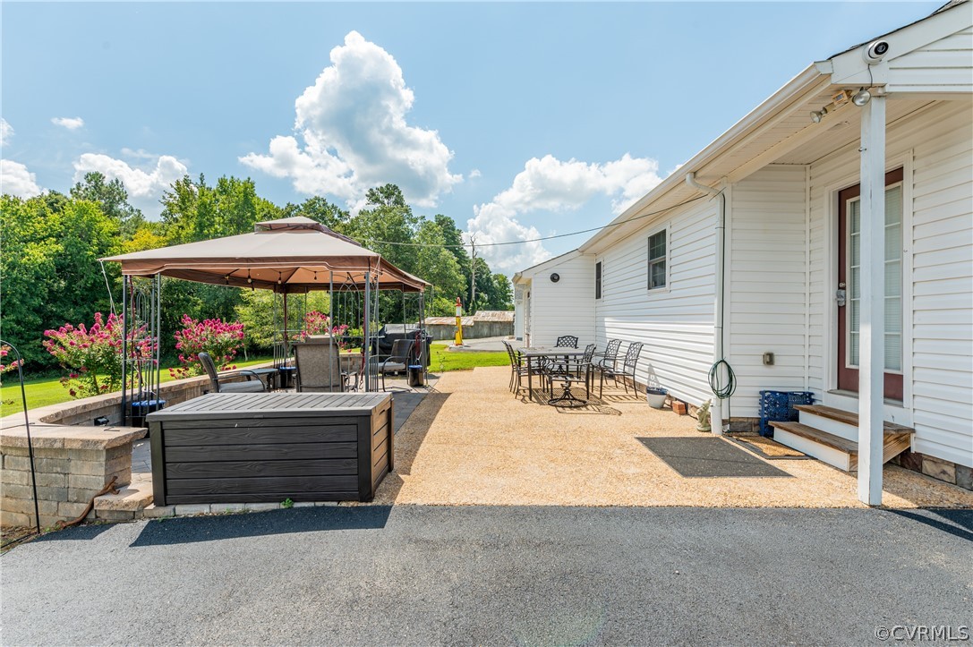 540 Clayville Road Powhatan, VA 23139 - Photo 20 of 42 Oversized patio overlooks the beautiful backyard a