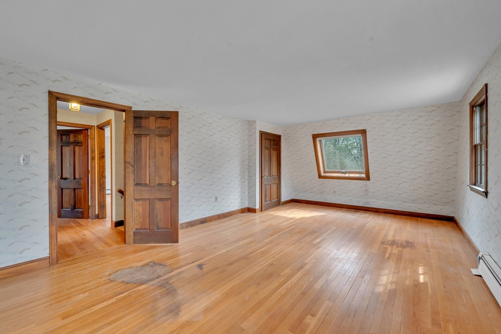 449 Summer Street North Andover, MA 01845 - Photo 16 of 26 a view of empty room with wooden floor and window