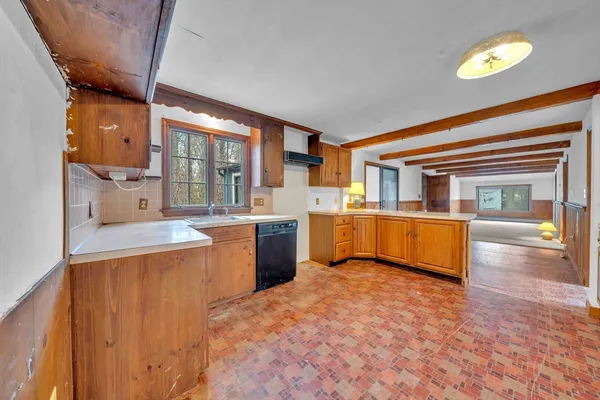 a kitchen with a sink and cabinets