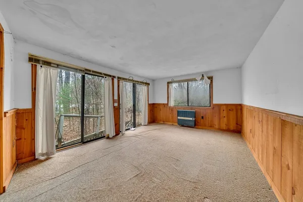 a view of an empty room with a balcony