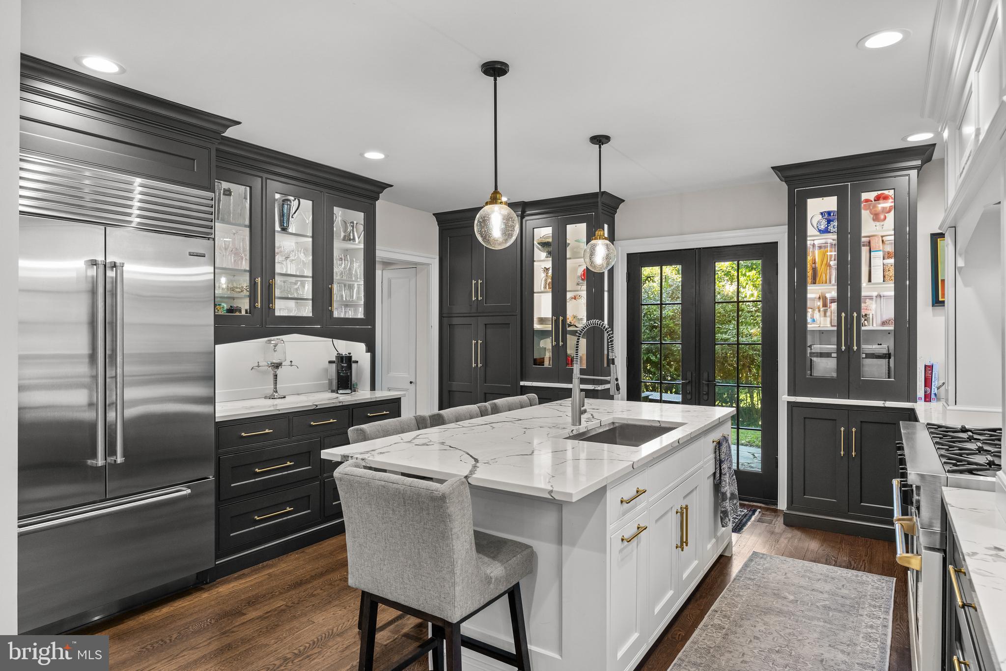 a kitchen with a stove a sink and a refrigerator
