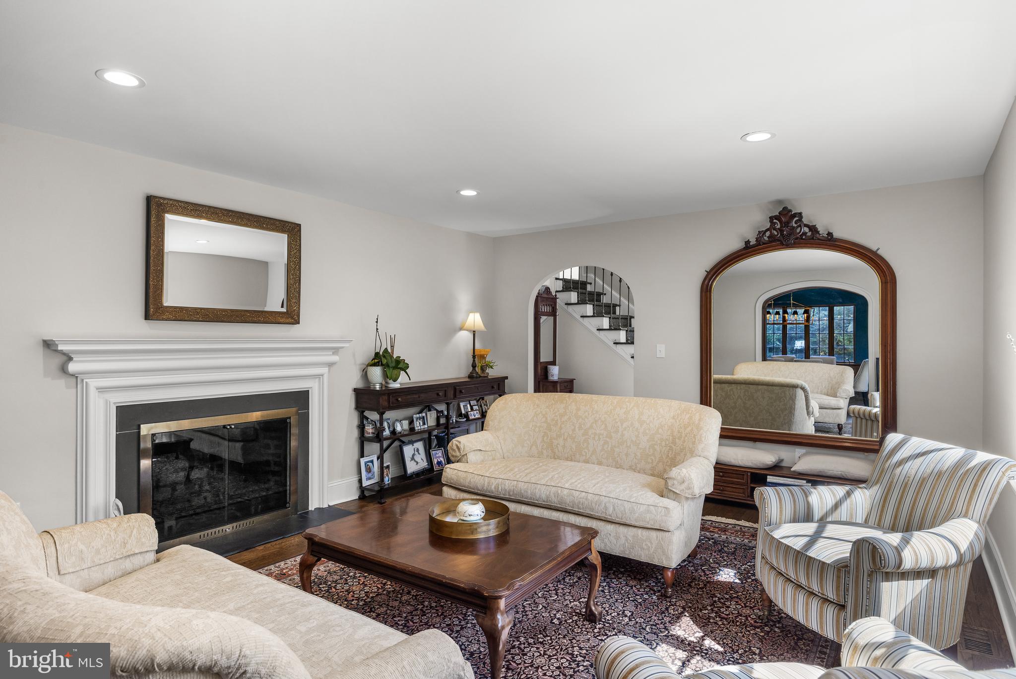 863 Golf View Road Moorestown, NJ 08057 - Photo 3 of 20 a living room with furniture a fireplace and a flat screen tv