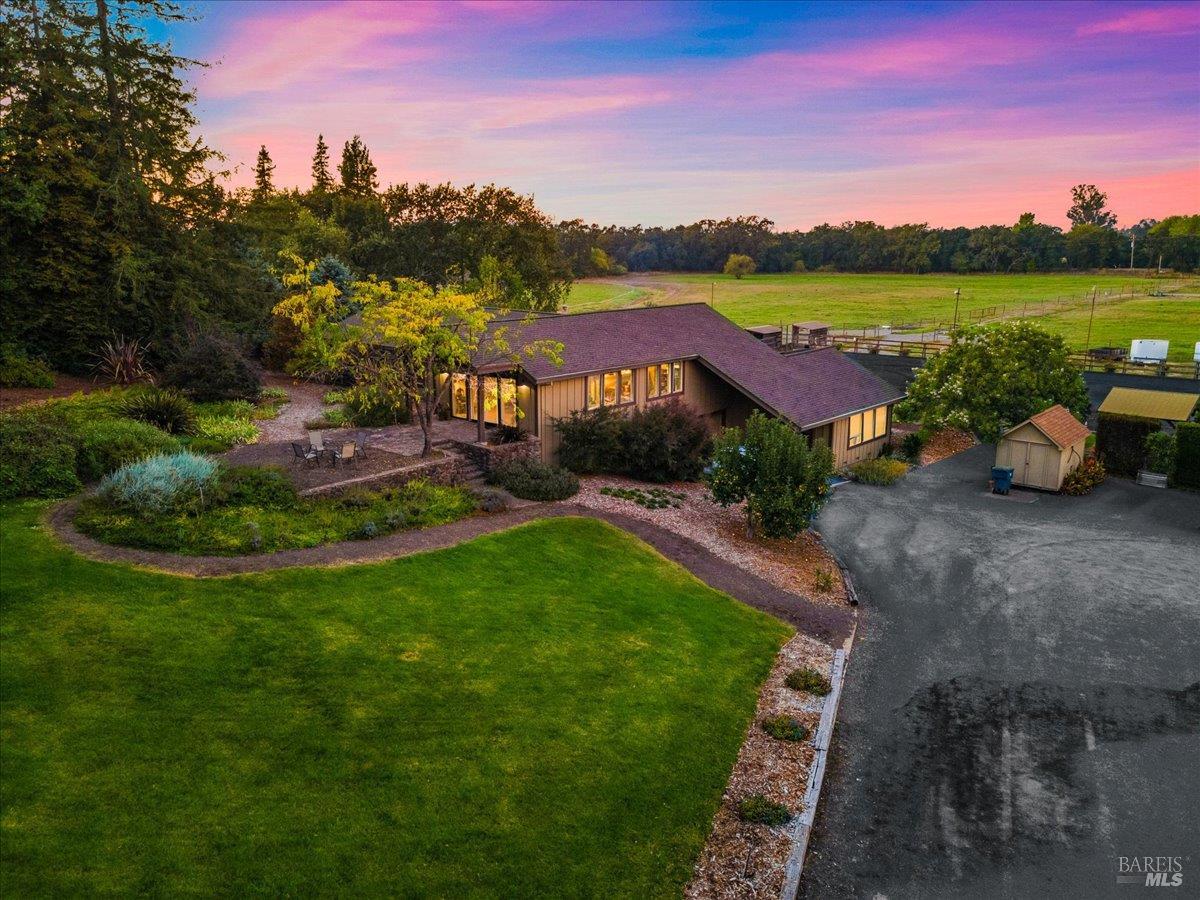 a view of lake with houses in the back
