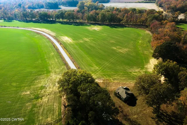 a view of a lake with a yard