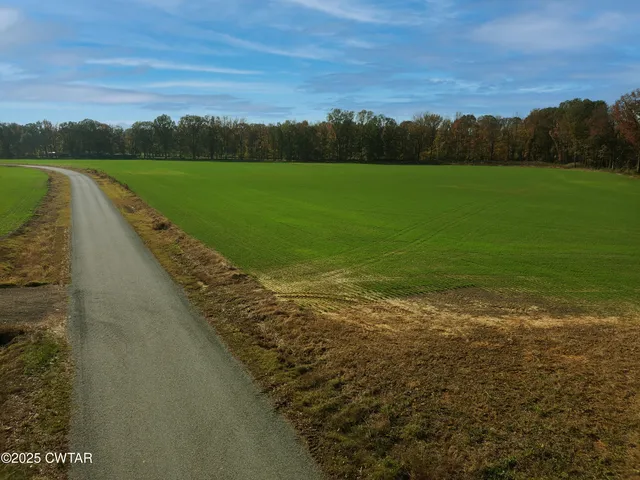 a view of a lake with a yard