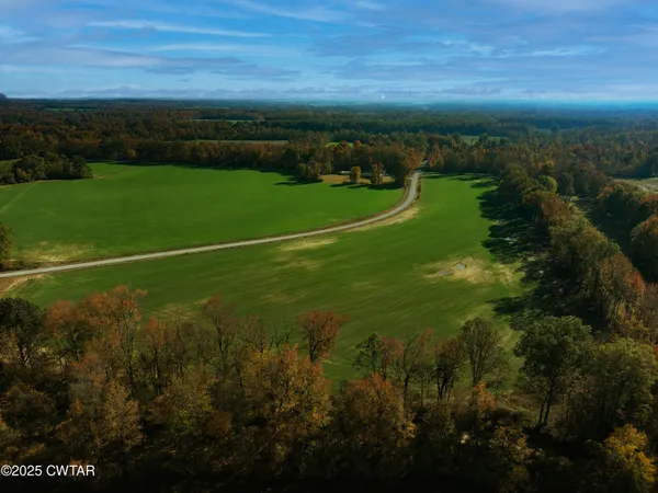 a view of a golf course with a lake