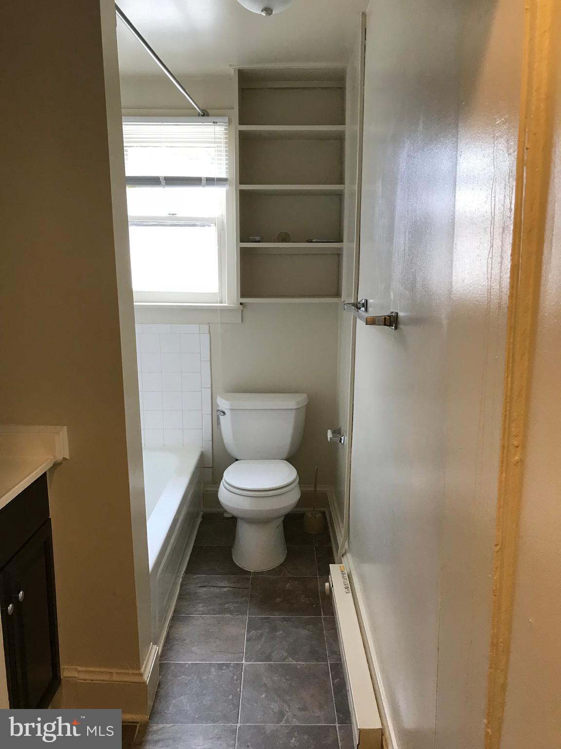 244 East Patrick Street, Unit 2 Frederick, MD 21701 - Photo 8 of 18 a bathroom with a toilet and a shower