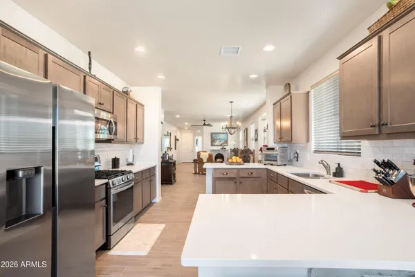 a kitchen with a sink cabinets and window