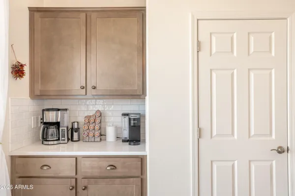 a kitchen with stainless steel appliances sink stove refrigerator and cabinets