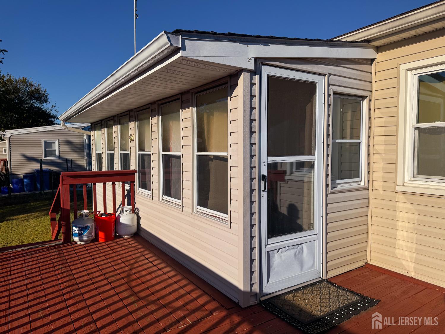 121 1st Street Middlesex, NJ 08846 - Photo 12 of 34 a view of a balcony with wooden floor and furniture