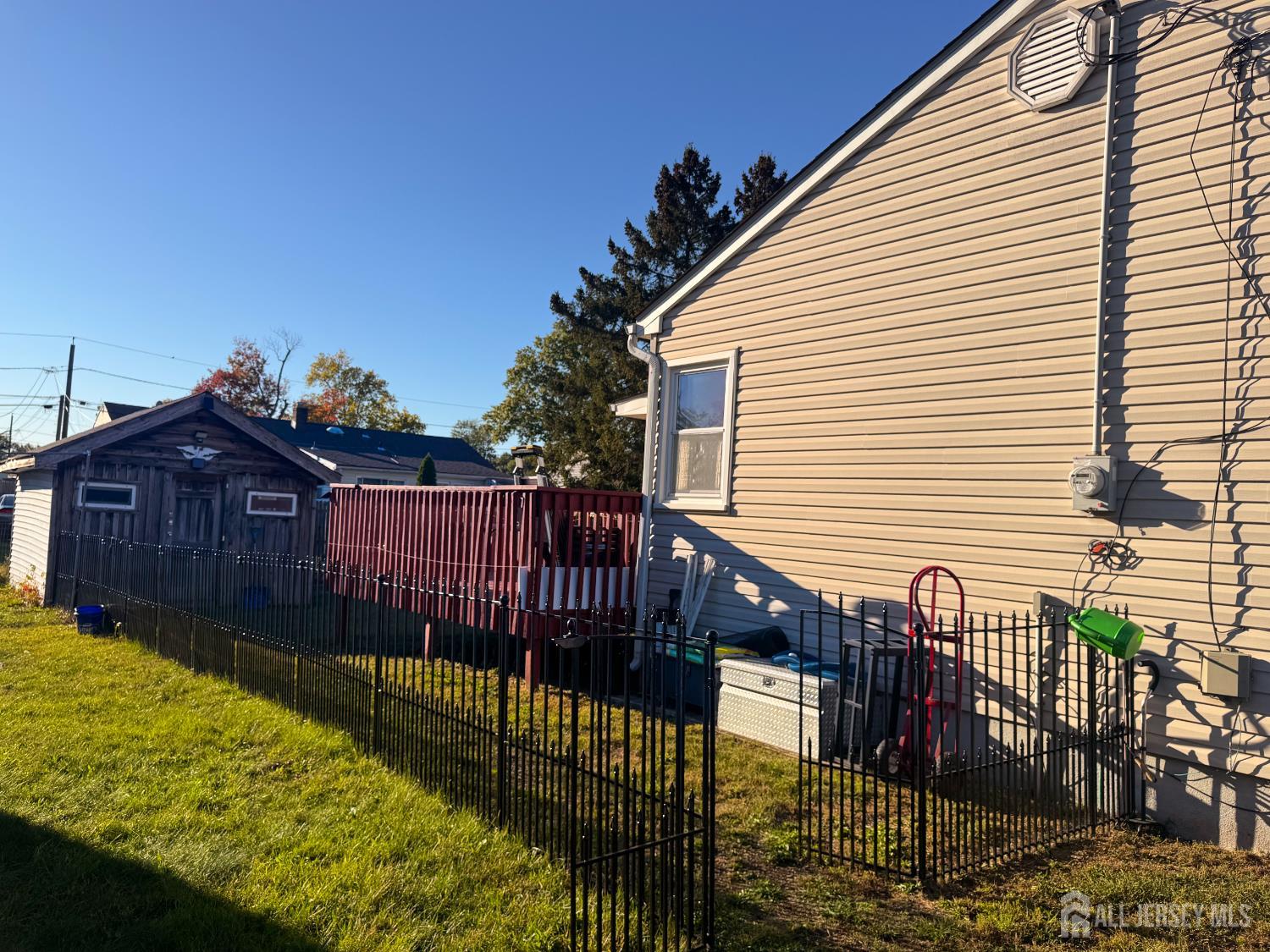 121 1st Street Middlesex, NJ 08846 - Photo 13 of 34 a view of a deck with a wooden fence