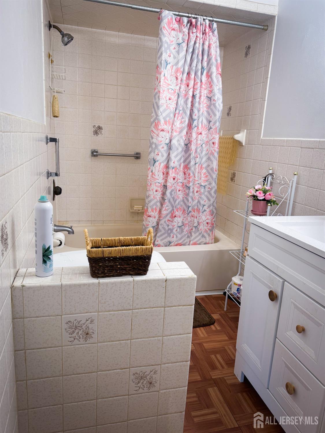 121 1st Street Middlesex, NJ 08846 - Photo 17 of 34 a bathroom with a sink a toilet and shower curtain