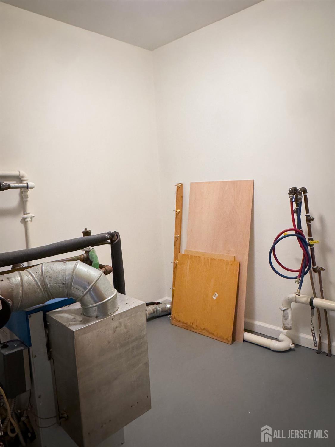 121 1st Street Middlesex, NJ 08846 - Photo 22 of 34 a room with a couch and gym equipment