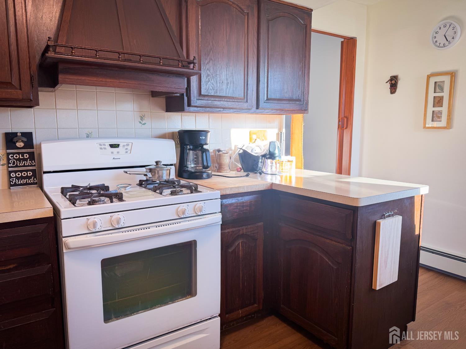 121 1st Street Middlesex, NJ 08846 - Photo 28 of 34 a kitchen with a stove and a microwave