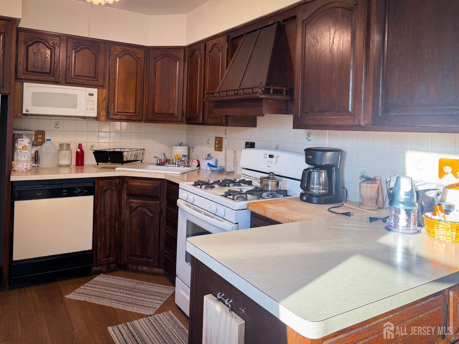 121 1st Street Middlesex, NJ 08846 - Photo 29 of 34 a kitchen with stainless steel appliances granite countertop a sink stove and cabinets