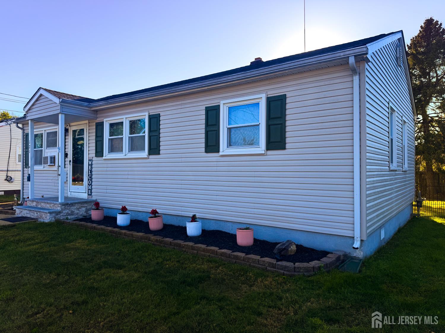 121 1st Street Middlesex, NJ 08846 - Photo 3 of 34 a front view of house with a garden
