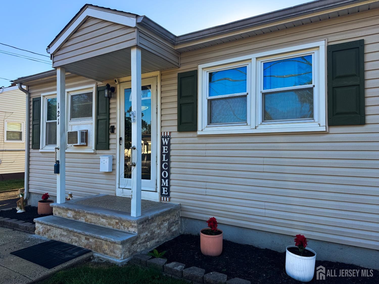 121 1st Street Middlesex, NJ 08846 - Photo 5 of 34 a view of a house with entrance and a potted plant