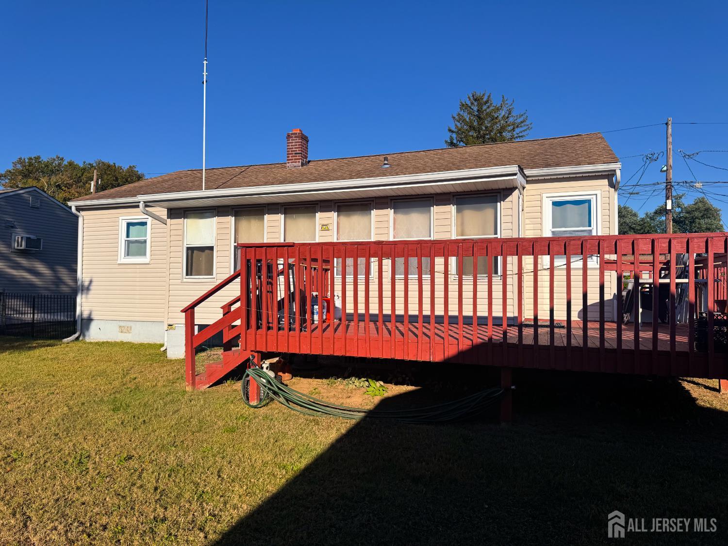 121 1st Street Middlesex, NJ 08846 - Photo 7 of 34 a front view of a house with a yard