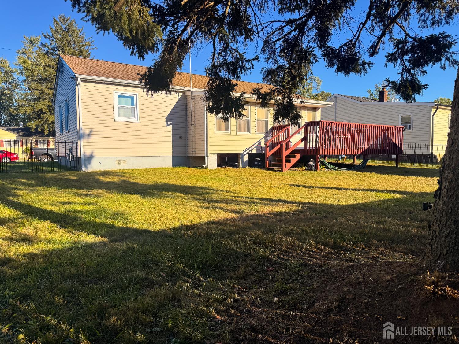 121 1st Street Middlesex, NJ 08846 - Photo 9 of 34 a view of a house with a yard and garage