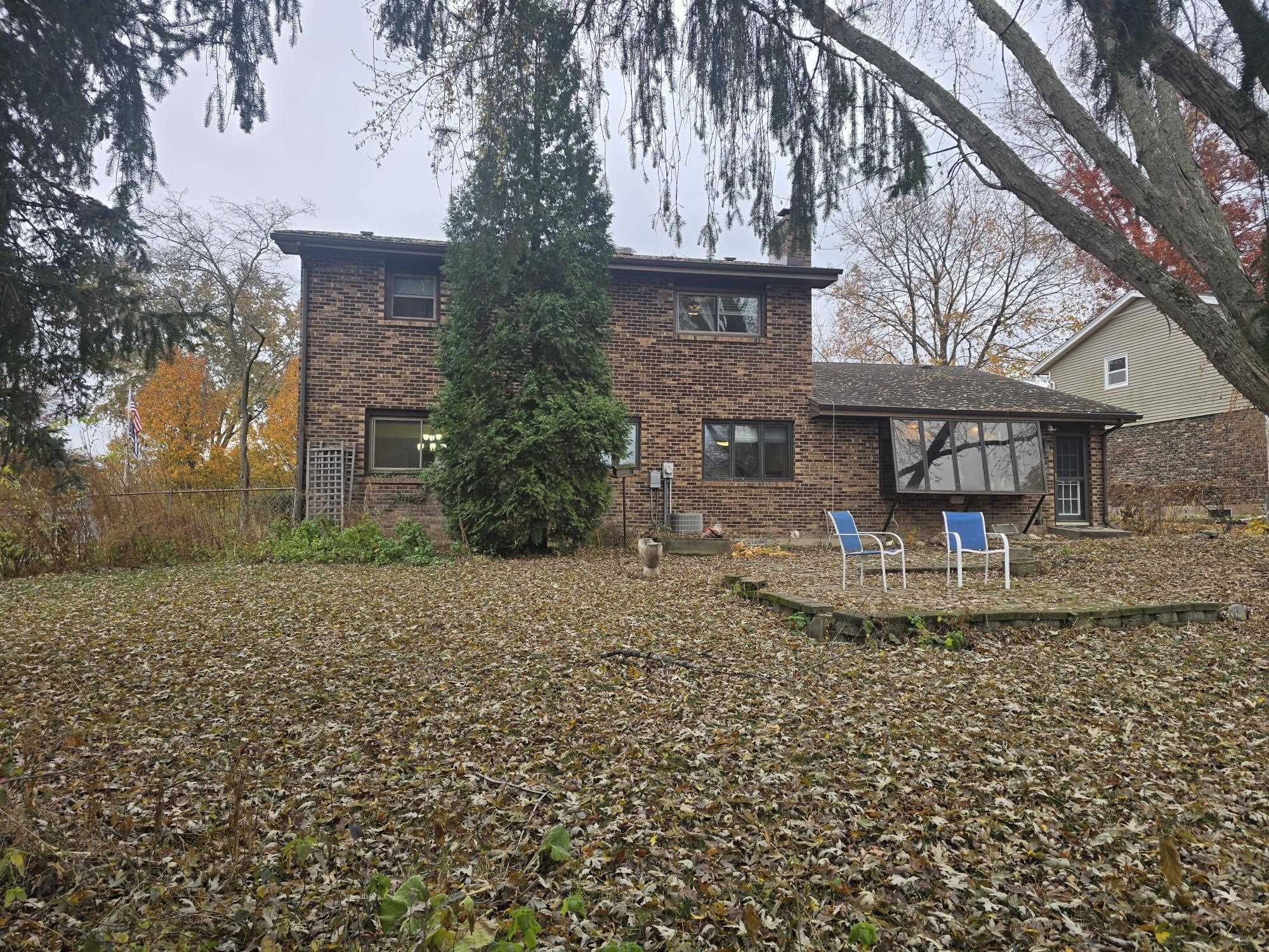 1208 Roxbury Close Rockford, IL 61107 - Photo 11 of 22 a view of a house with backyard