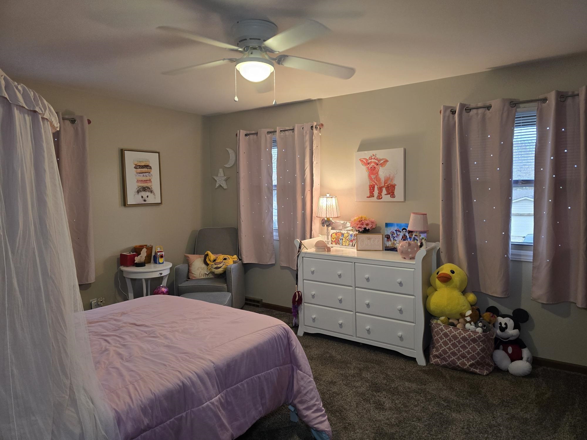 1208 Roxbury Close Rockford, IL 61107 - Photo 13 of 22 a bedroom with a bed and a dresser in it