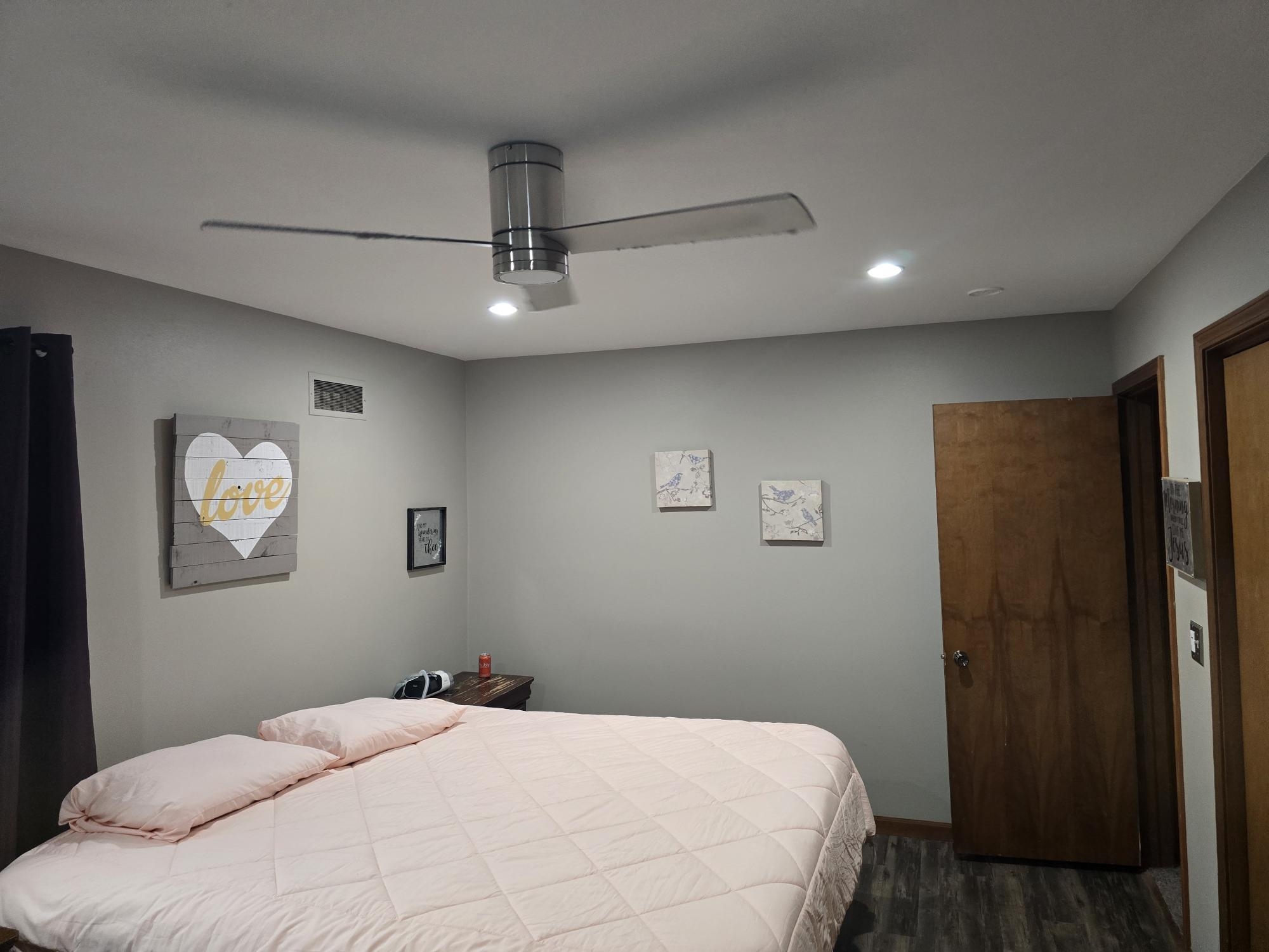 1208 Roxbury Close Rockford, IL 61107 - Photo 14 of 22 a bedroom with a large bed and a chandelier