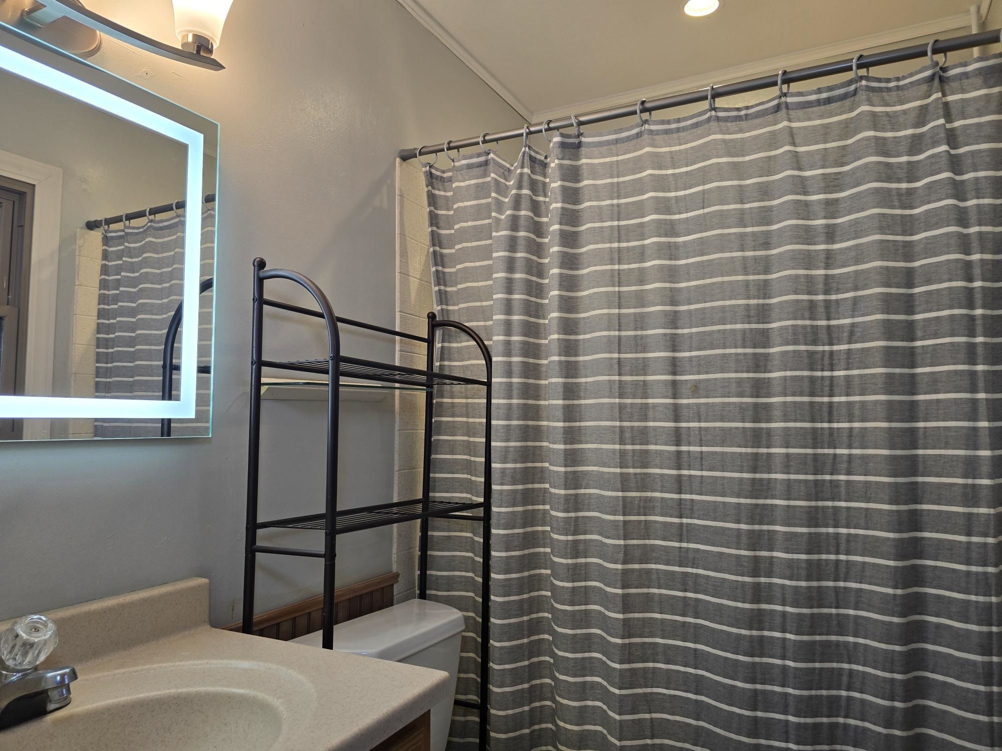 1208 Roxbury Close Rockford, IL 61107 - Photo 15 of 22 a bathroom with a sink toilet and shower