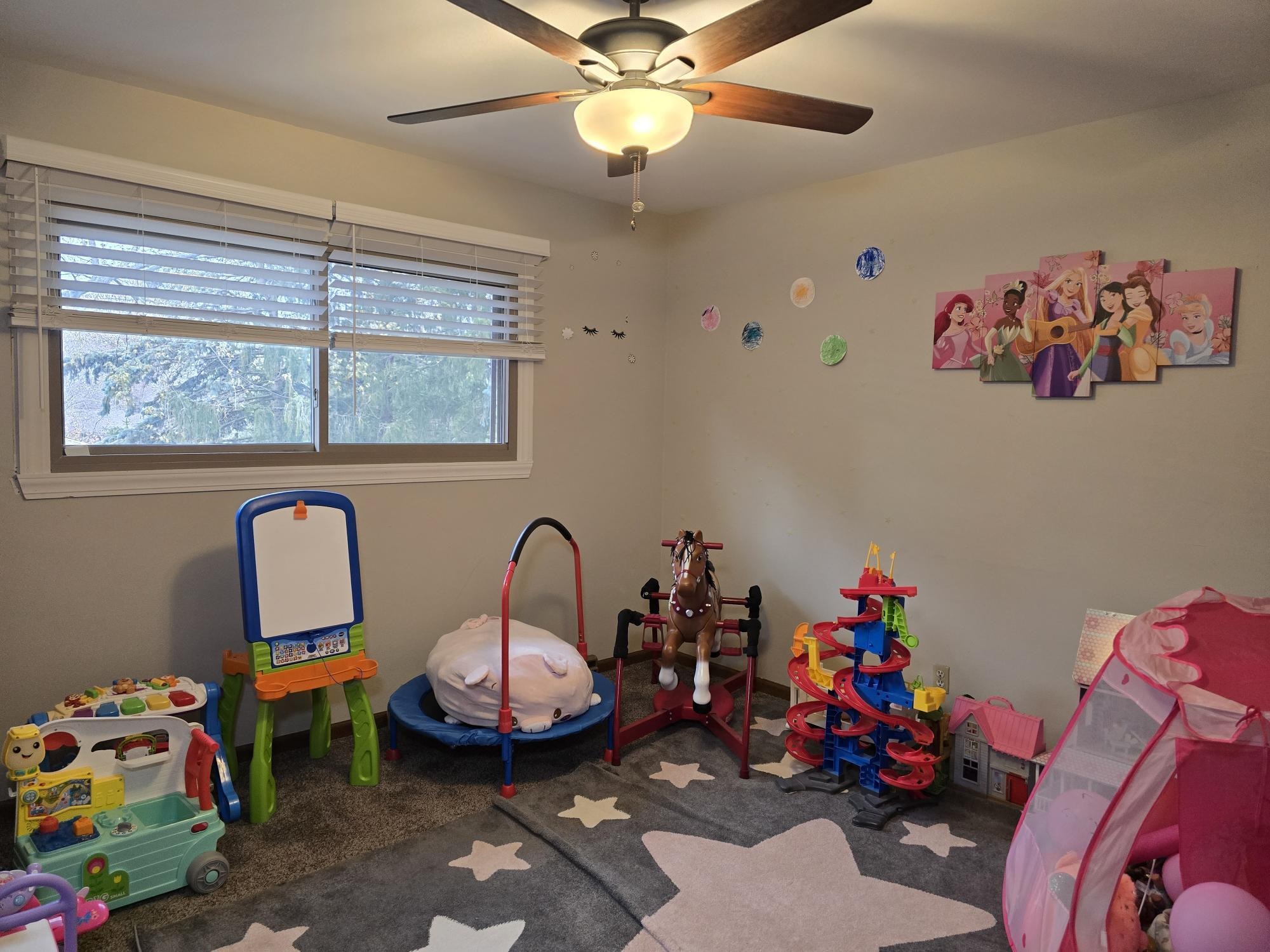 1208 Roxbury Close Rockford, IL 61107 - Photo 17 of 22 a view of a room with toys and a chandelier