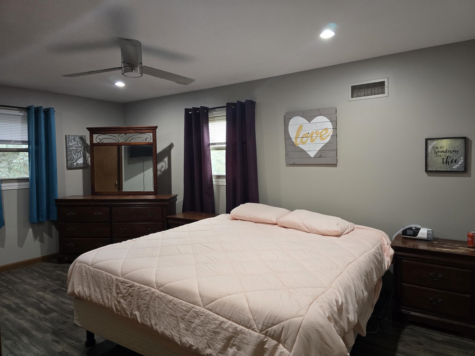 1208 Roxbury Close Rockford, IL 61107 - Photo 10 of 22 a bedroom with a bed and a chandelier