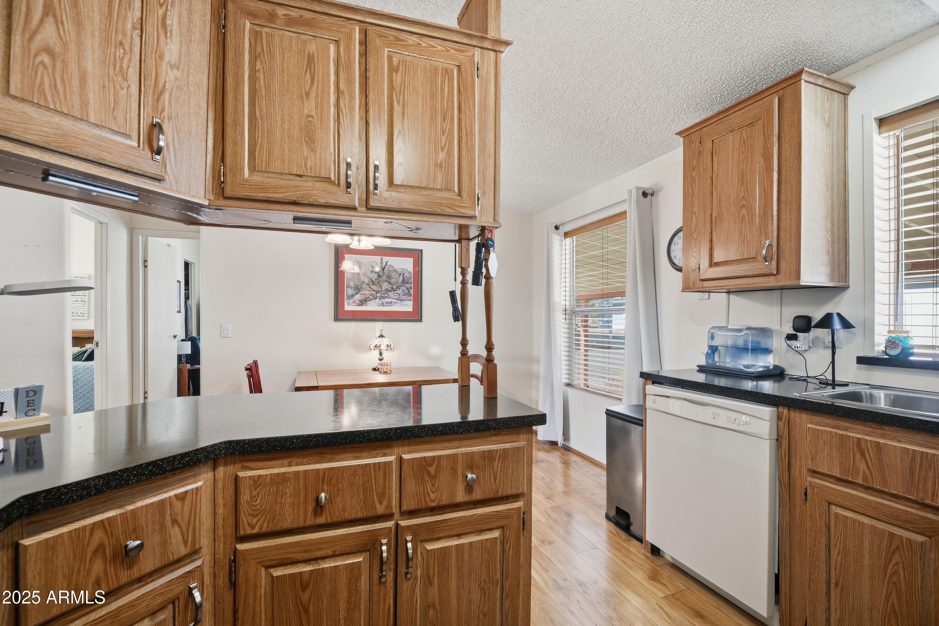 2050 West State Rte 89A, Unit 92 Sedona, AZ 86336 - Photo 13 of 34 a kitchen with stainless steel appliances granite countertop a sink stove and cabinets