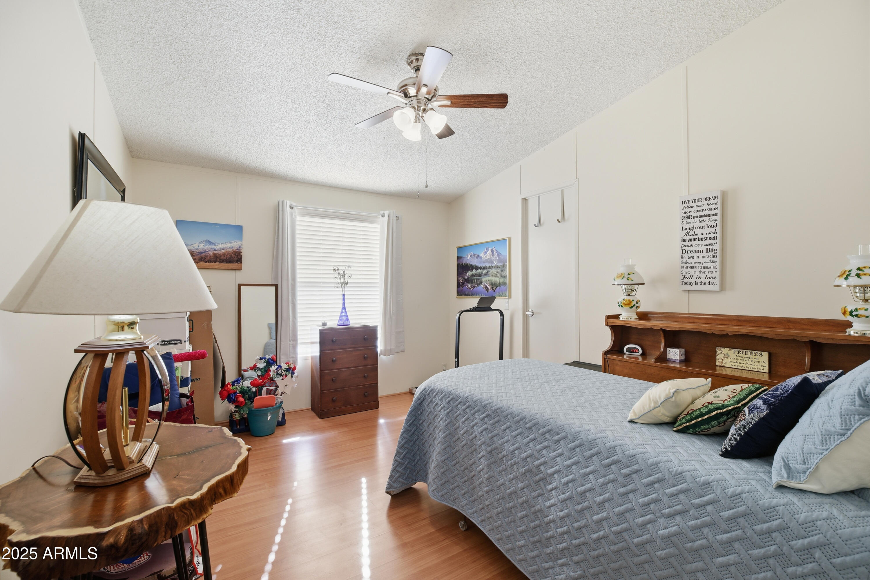 2050 West State Rte 89A, Unit 92 Sedona, AZ 86336 - Photo 25 of 34 a bedroom with a bed and a chandelier