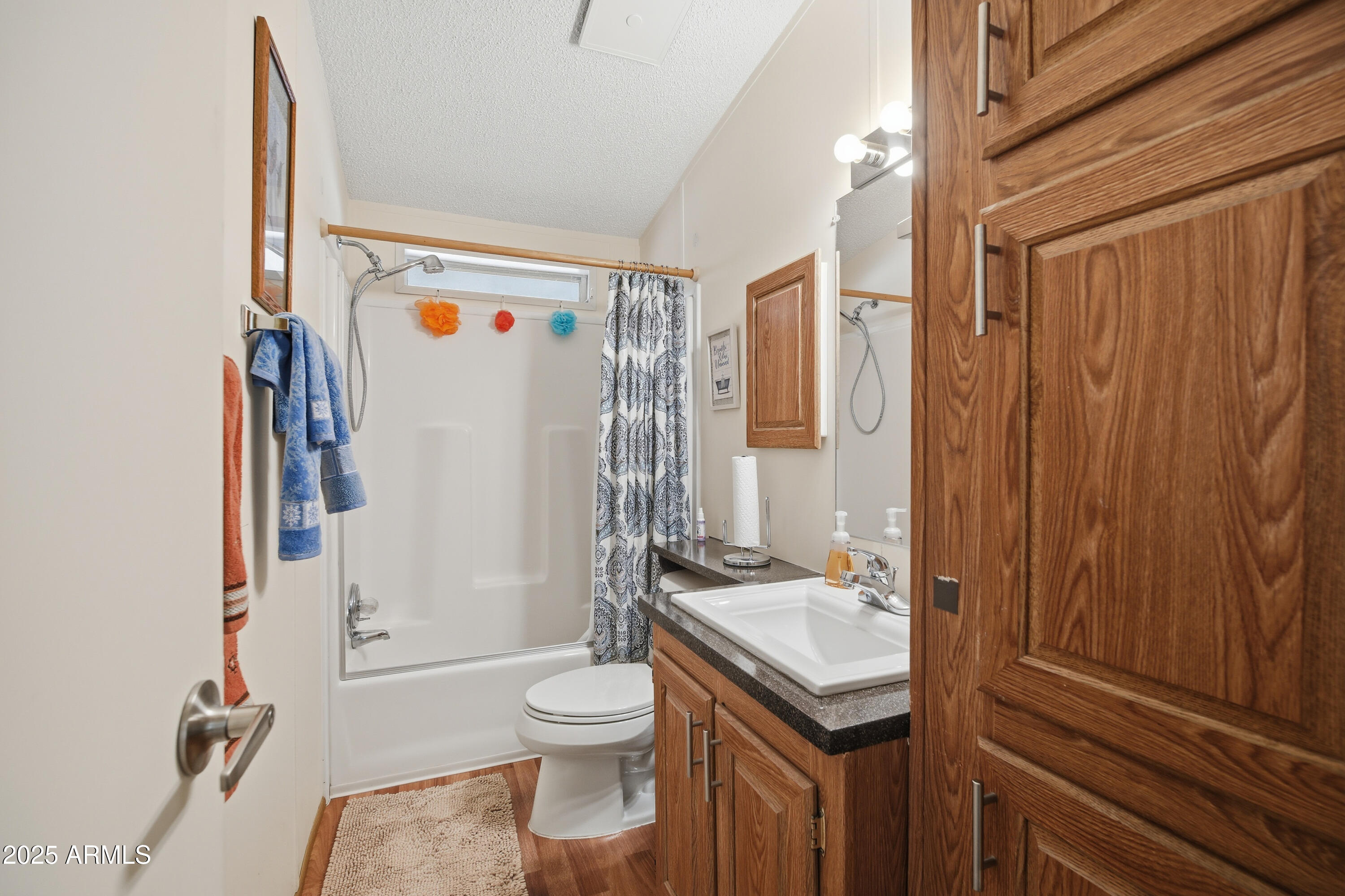 2050 West State Rte 89A, Unit 92 Sedona, AZ 86336 - Photo 27 of 34 a bathroom with a granite countertop sink toilet and shower
