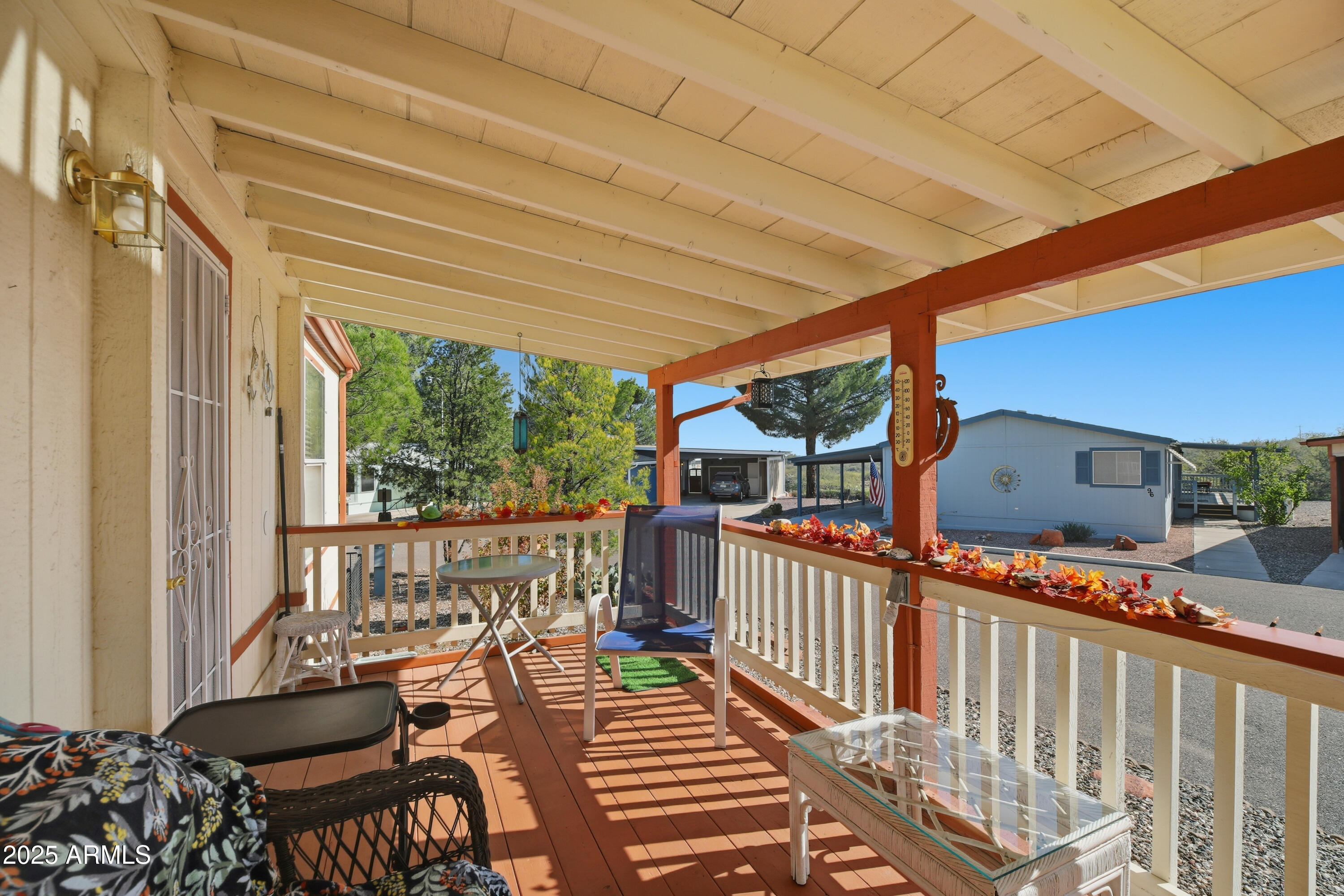 2050 West State Rte 89A, Unit 92 Sedona, AZ 86336 - Photo 29 of 34 a view of a patio with a table chairs and a porch