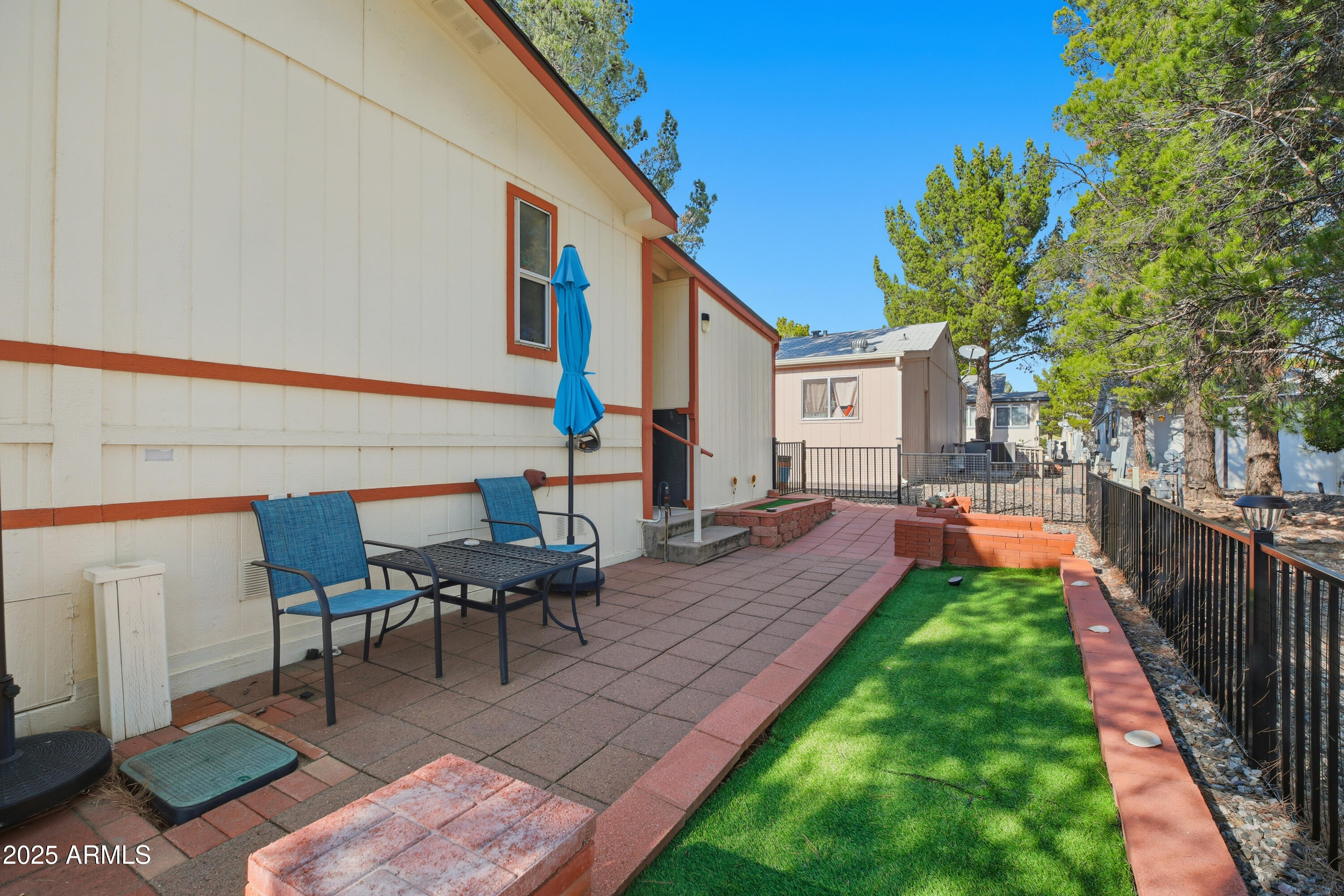2050 West State Rte 89A, Unit 92 Sedona, AZ 86336 - Photo 32 of 34 a view of a house with backyard porch and sitting area