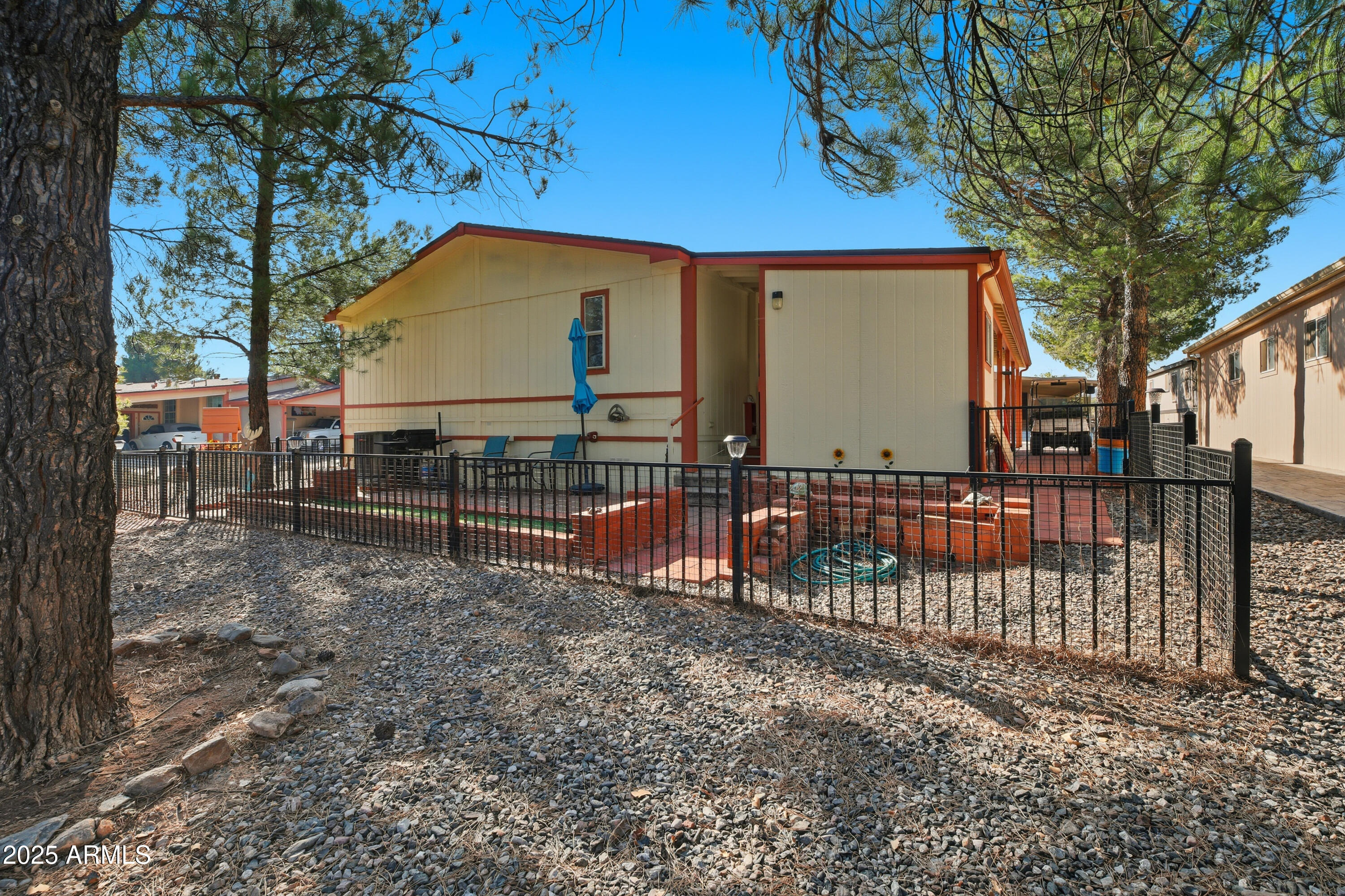 2050 West State Rte 89A, Unit 92 Sedona, AZ 86336 - Photo 34 of 34 a view of backyard with wooden fence