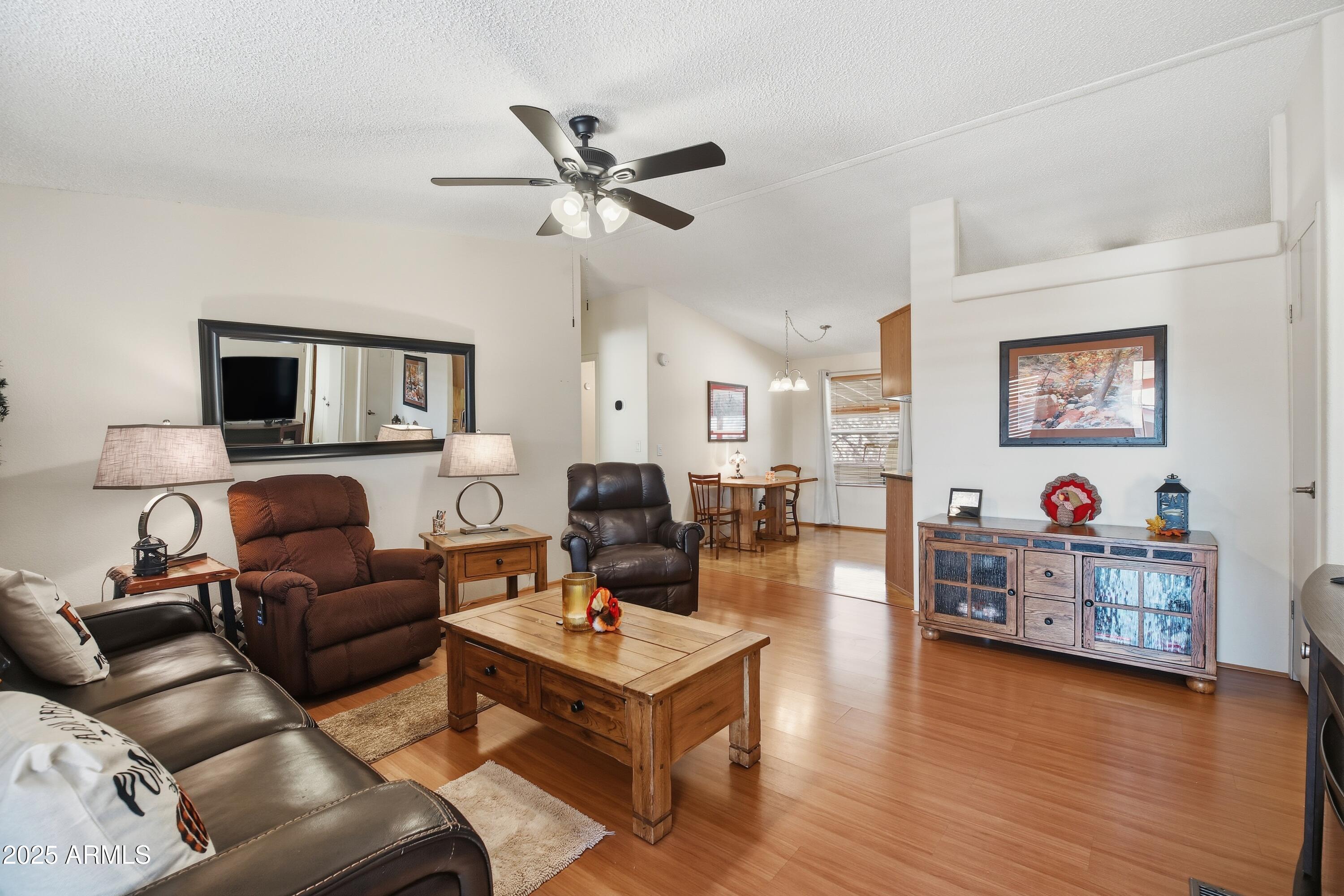 2050 West State Rte 89A, Unit 92 Sedona, AZ 86336 - Photo 5 of 34 a living room with furniture and a wooden floor