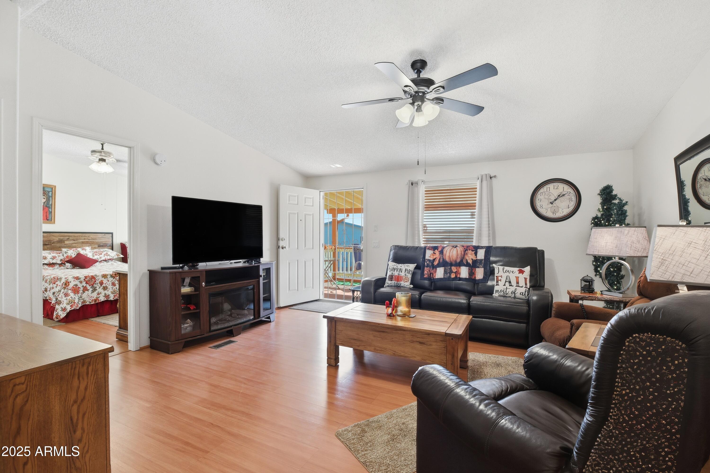 2050 West State Rte 89A, Unit 92 Sedona, AZ 86336 - Photo 7 of 34 a living room with furniture and a flat screen tv