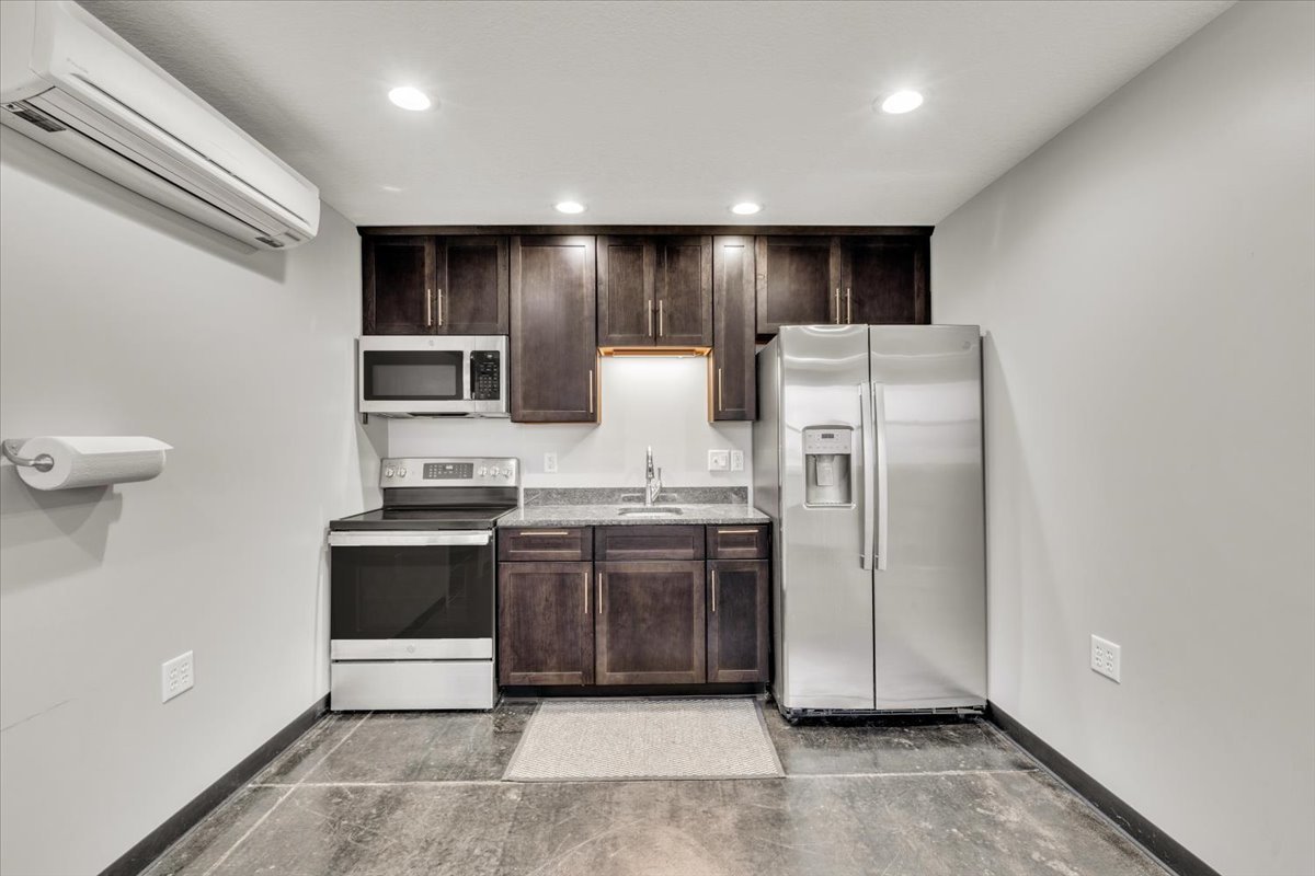 602 2nd Street West Andalusia, IL 61232 - Photo 12 of 71 a kitchen with stainless steel appliances granite countertop a refrigerator and a stove