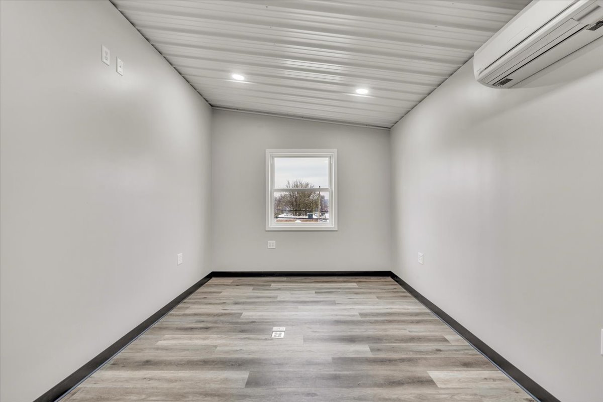 602 2nd Street West Andalusia, IL 61232 - Photo 19 of 71 a view of empty room with wooden floor