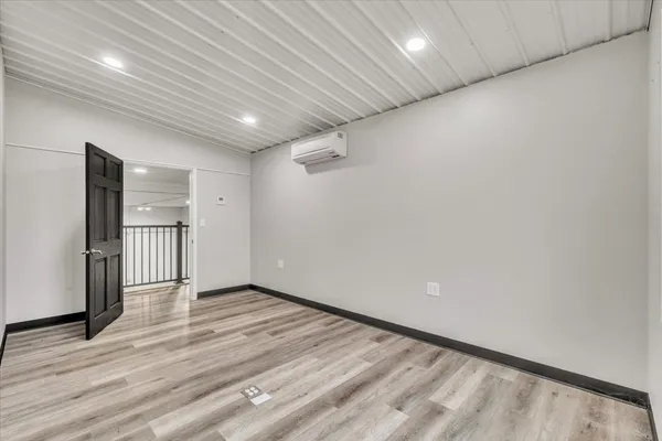 a picture of a bathroom with a shower and a window