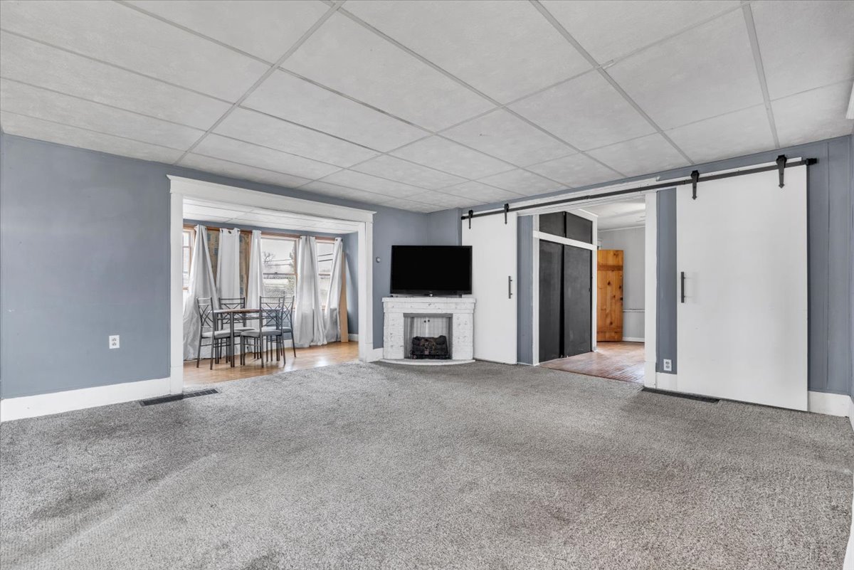 602 2nd Street West Andalusia, IL 61232 - Photo 43 of 71 a view of a livingroom with an empty space and a fireplace