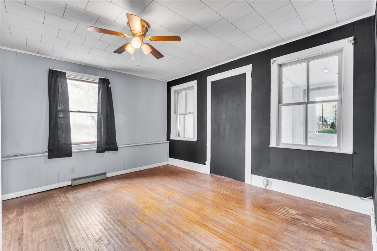 602 2nd Street West Andalusia, IL 61232 - Photo 53 of 71 an empty room with wooden floor and windows