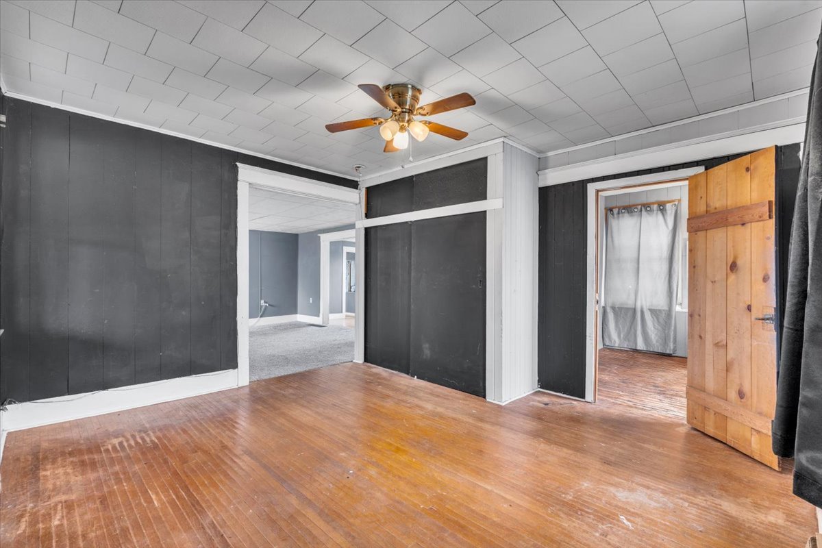 602 2nd Street West Andalusia, IL 61232 - Photo 54 of 71 a view of a livingroom with a ceiling fan & entryway