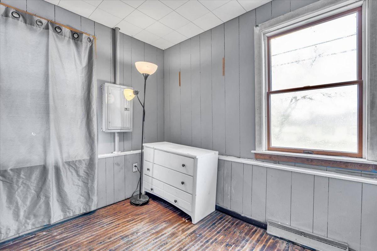 602 2nd Street West Andalusia, IL 61232 - Photo 56 of 71 a view of an empty room with wooden floor and a window