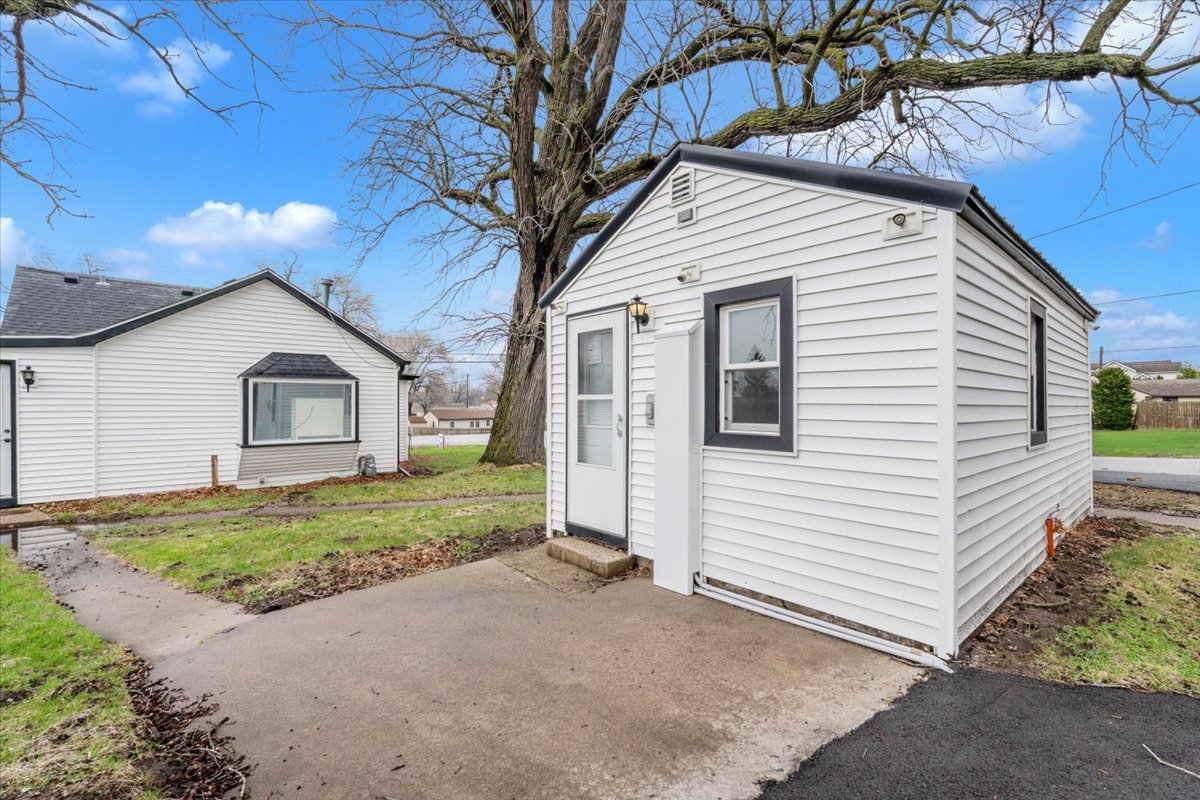 602 2nd Street West Andalusia, IL 61232 - Photo 63 of 71 a front view of a house with a yard and garage