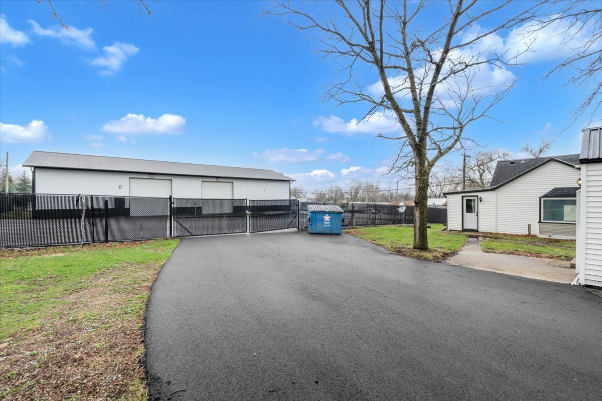 602 2nd Street West Andalusia, IL 61232 - Photo 68 of 71 a view of a house with backyard and a tree