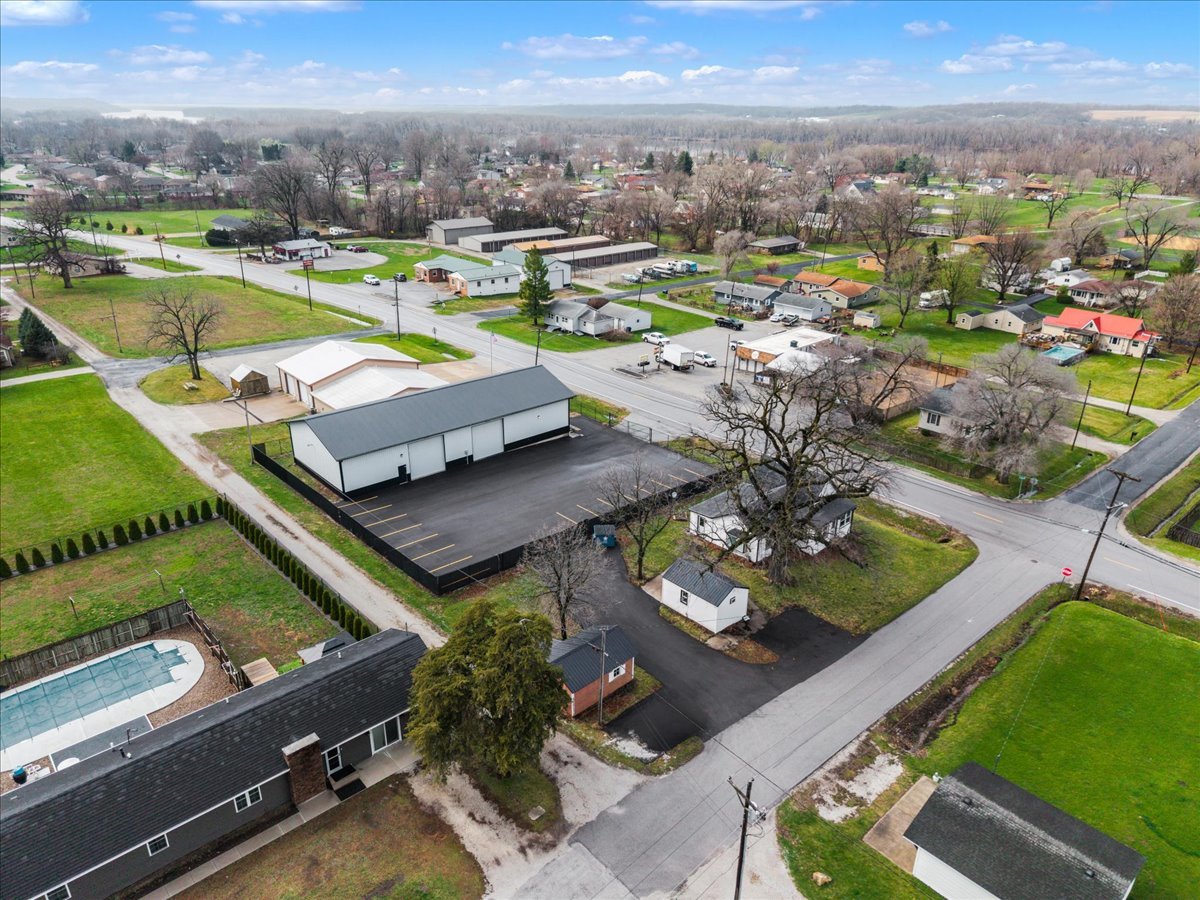 602 2nd Street West Andalusia, IL 61232 - Photo 71 of 71 an aerial view of a house with a swimming pool yard and outdoor seating